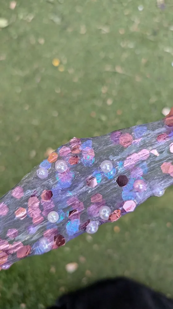Pink and purple sequins on a strip of fabric